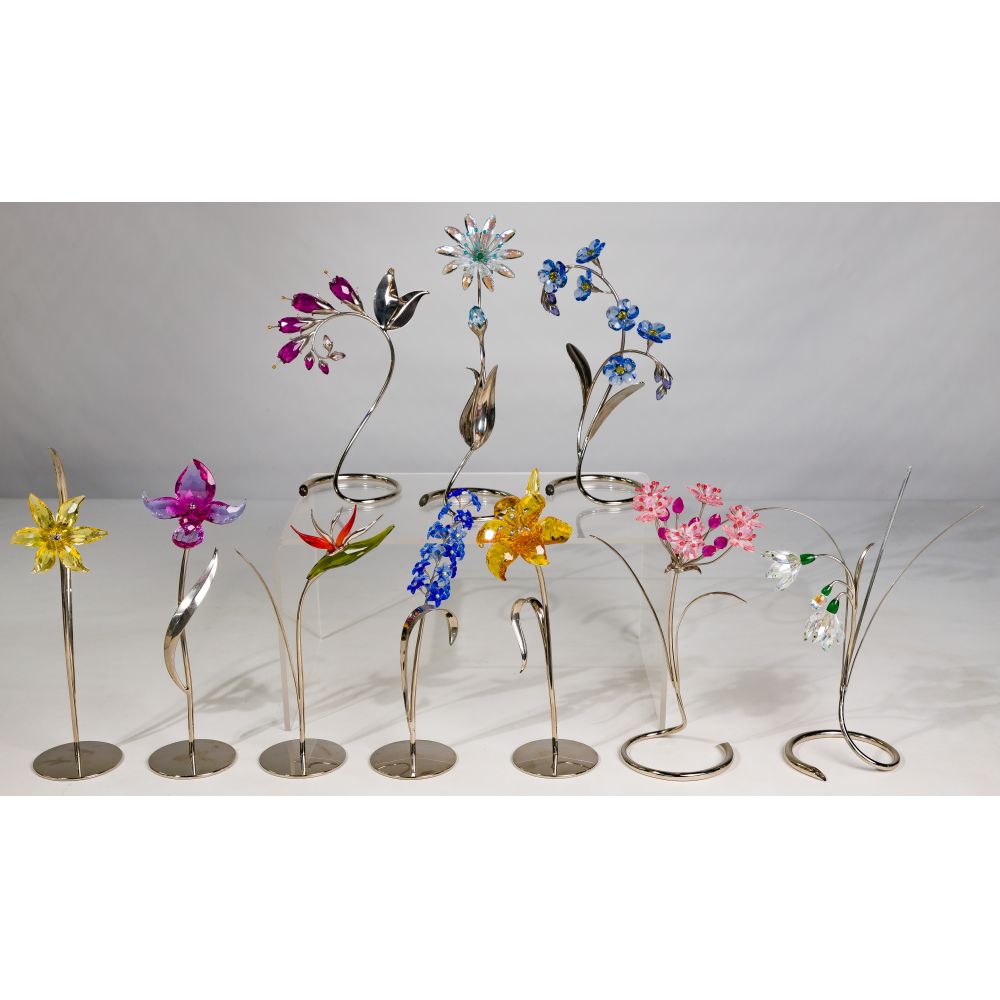 Appraisal: SWAROVSKI CRYSTAL FLOWER ASSORTMENT crystal items including an Orchid Delphinium