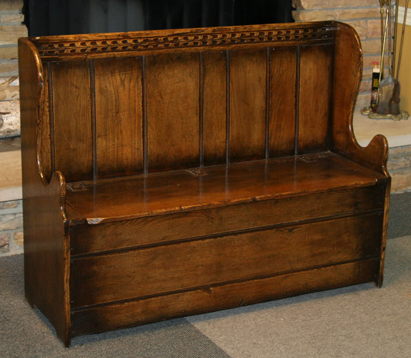 Appraisal: English carved wooden settle bench with lift seat single piece