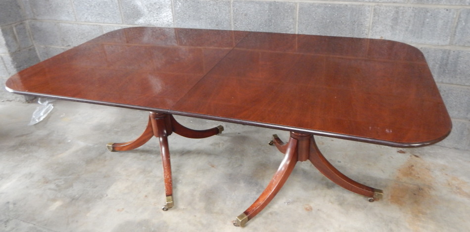 Appraisal: A Regency style mahogany twin pedestal dining table with a