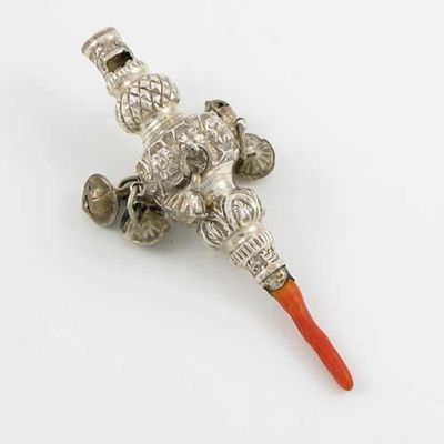 Appraisal: A Victorian embossed rattle with five fluted bells a whistle