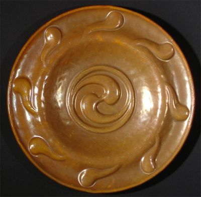 Appraisal: A Carter's Poole lustre charger modelled in low relief with