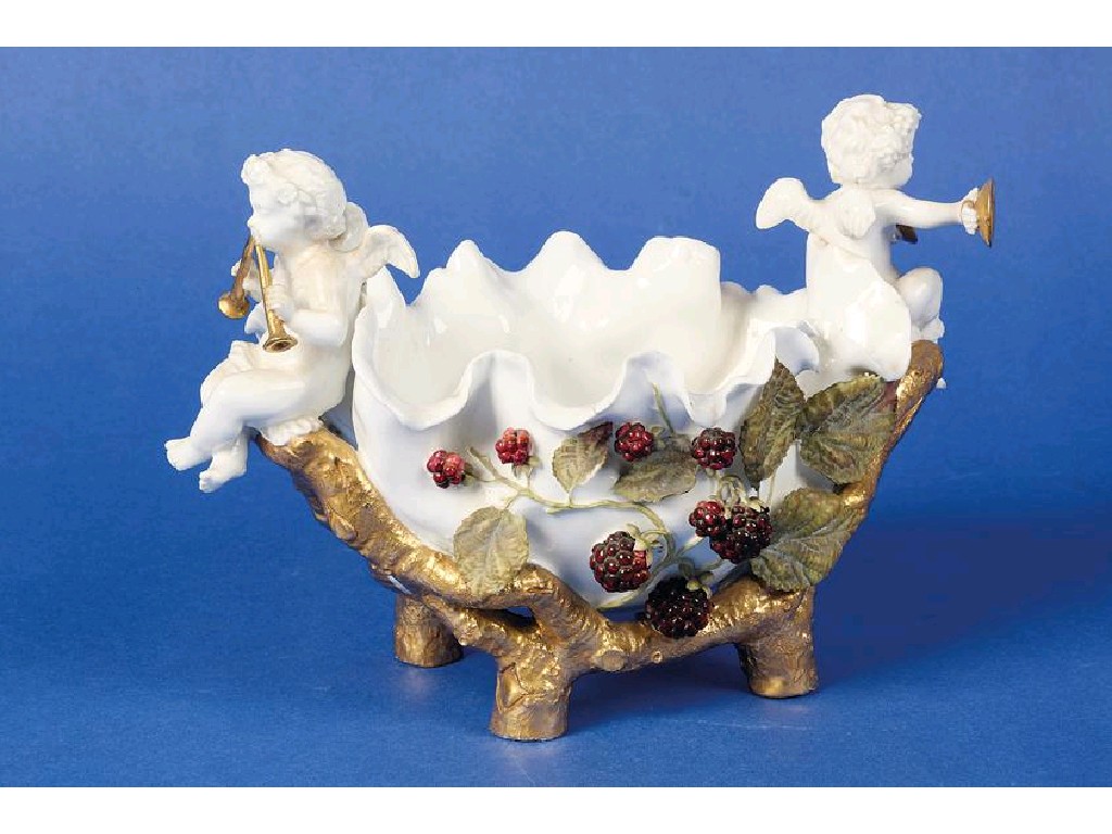 Appraisal: A MOORE BROTHERS BASKET modelled with musical cherubs and polychrome