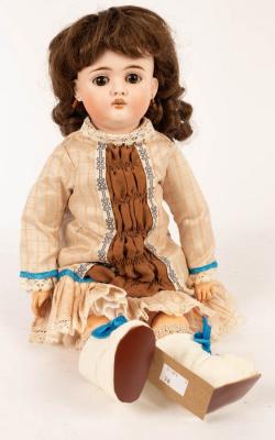 Appraisal: A bisque head doll with white boots and later clothes