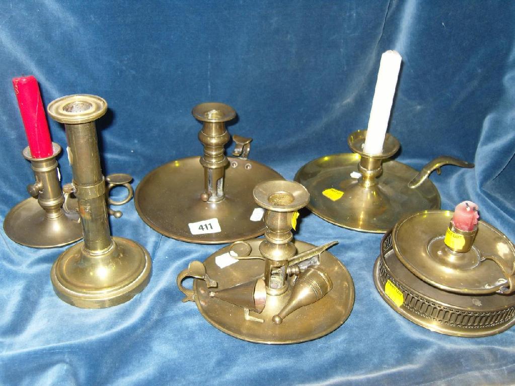 Appraisal: A collection of brass chamber sticks of various design together