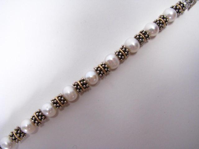 Appraisal: Sterling silver k yellow gold and pearl bracelet with toggle