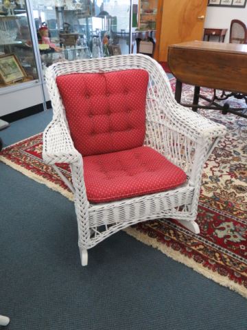 Appraisal: Antique Wicker Rocker with red cushions