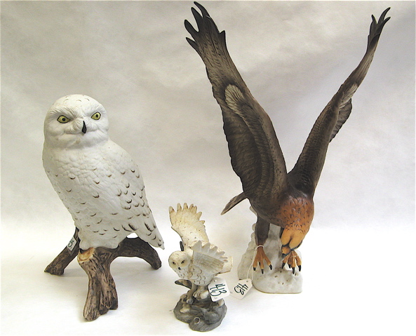 Appraisal: THREE PAINTED BISQUE BIRD FIGURES two by Royal Dux Bohemia