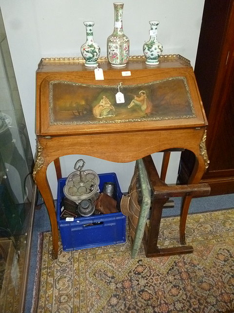 Appraisal: A CONTINENTAL ROSEWOOD BUREAU DE DAME with pierced brass gallery