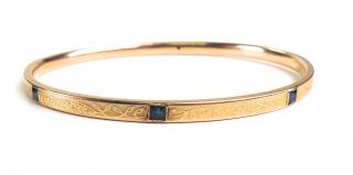 Appraisal: k y g bangle having small square cut sapphires and