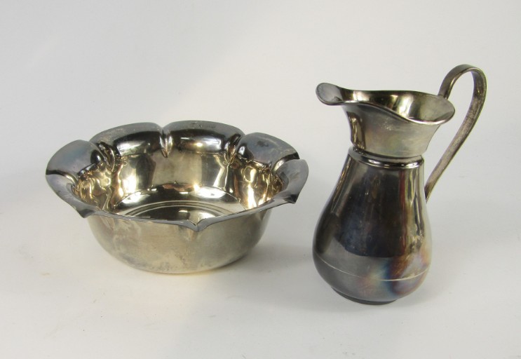 Appraisal: An Edward VII silver cream jug Birmingham and a fluted