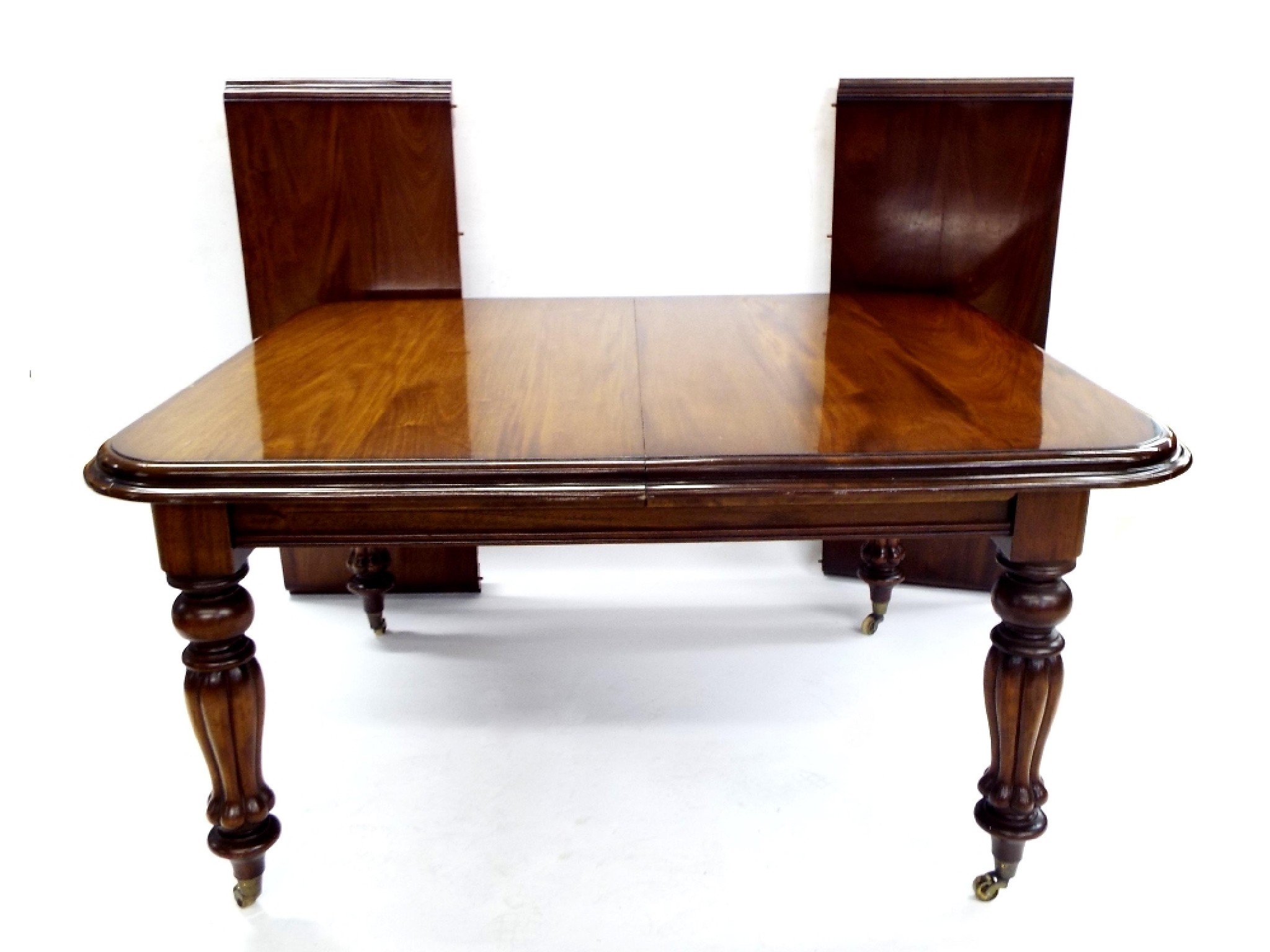 Appraisal: Victorian style mahogany extending dining table the moulded top upon