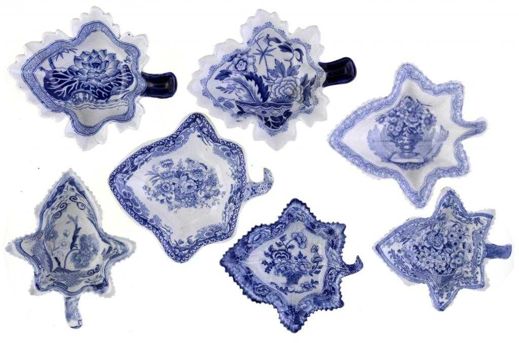 Appraisal: SEVEN BLUE PRINTED EARTHENWARE AND STONE CHINA PICKLE DISHES of