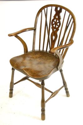 Appraisal: An ash and beechwood Windsor armchair with a wheel back