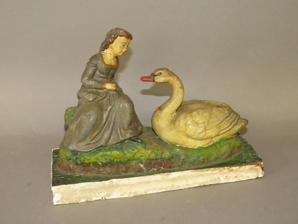 Appraisal: GERMAN GIRL AND SWAN SQUEAK TOYca - large molded papier