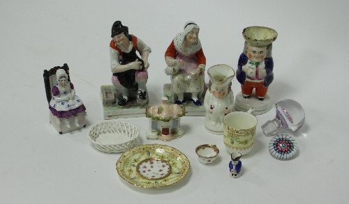 Appraisal: A pair of Staffordshire figures depicting a cobbler and a