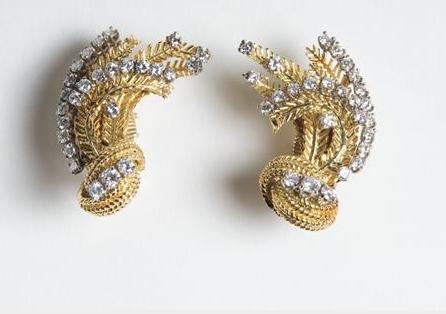 Appraisal: PAIR OF GOLD AND DIAMOND EARCLIPS In the form of