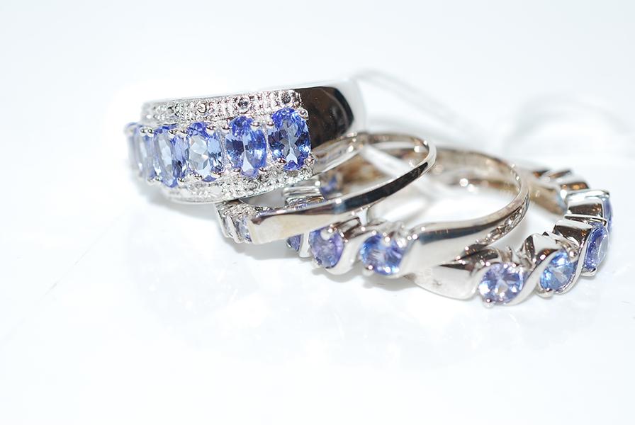 Appraisal: THREE STERLING SILVER AND TANZANITE RINGS AND ONE OTHER TANZANITE