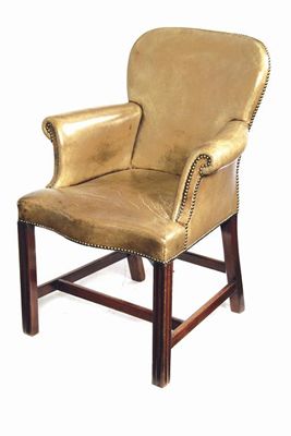 Appraisal: A brass studded and leather upholstered armchair with scroll arms