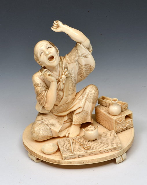 Appraisal: A JAPANESE IVORY OKIMONO seated artisan signed Muneyuki late Meiji