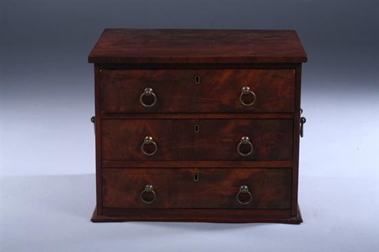 Appraisal: MAHOGANY THREE-DRAWER DIMINUTIVE CHEST late th century with brass ring-pull