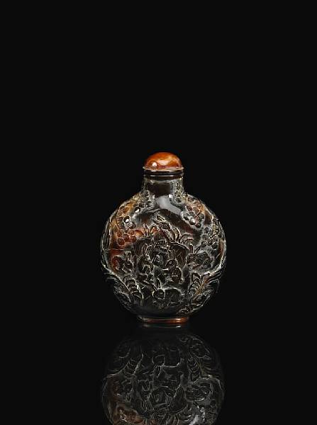 Appraisal: A carved tortoise shell snuff bottle th Century Of flattened