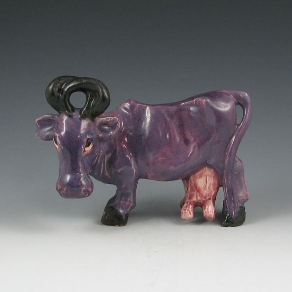 Appraisal: Brayton Laguna purple cow figure Unmarked Couple of minute glaze