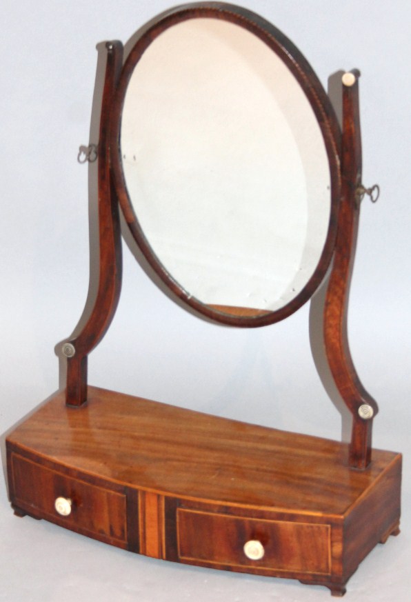 Appraisal: A George III mahogany bow front table mirror the oval