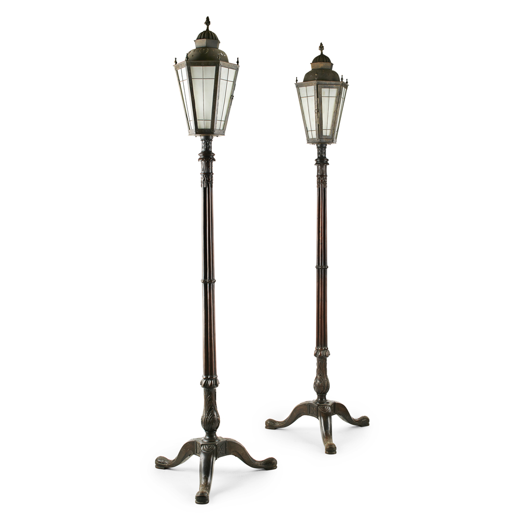 Appraisal: PAIR OF MAHOGANY STANDARD LAMPS each reeded and carved column