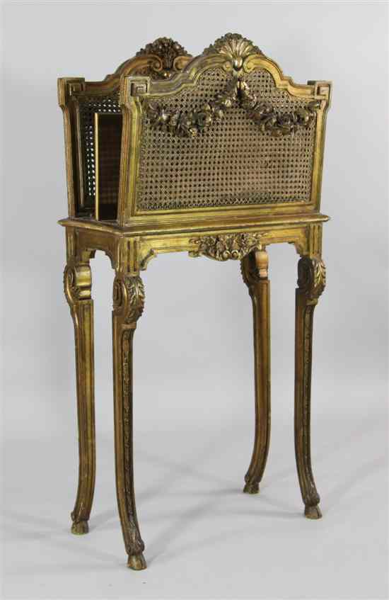 Appraisal: A late th century French carved giltwood two division canterbury