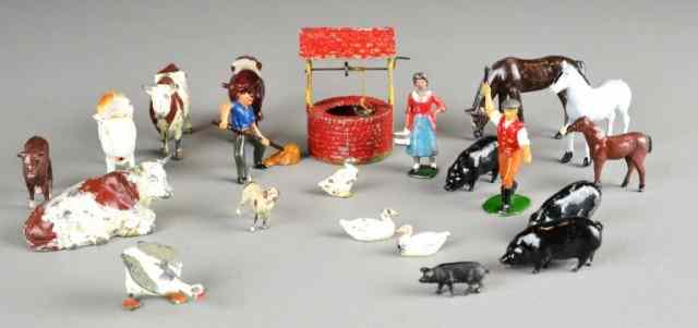 Appraisal: British Metal ToysIncluding a painted metal well cow and lady