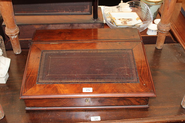 Appraisal: A VICTORIAN WALNUT WRITING SLOPE with leather inset top and