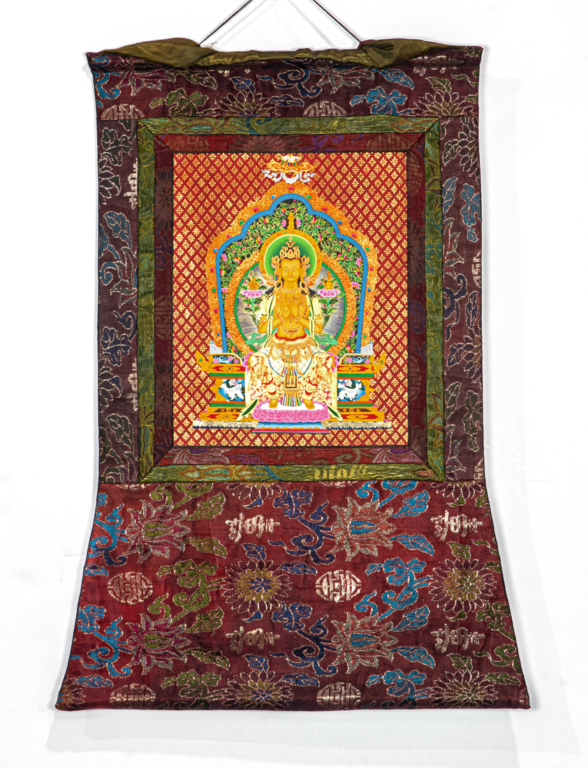 Appraisal: Tibetan thangka mounted in silk brocade h x w