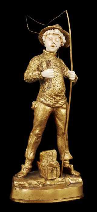 Appraisal: A gilt bronze and ivory model of a fisher boy