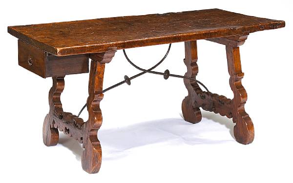 Appraisal: A Spanish Baroque iron mounted walnut table The rectangular top