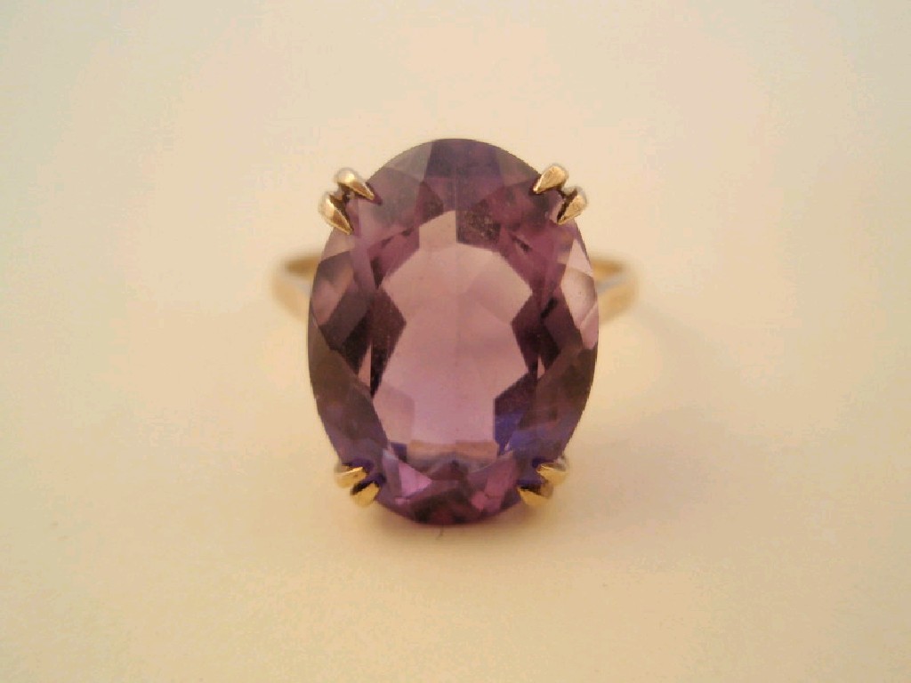 Appraisal: A ct gold dress ring set with an oval amethyst