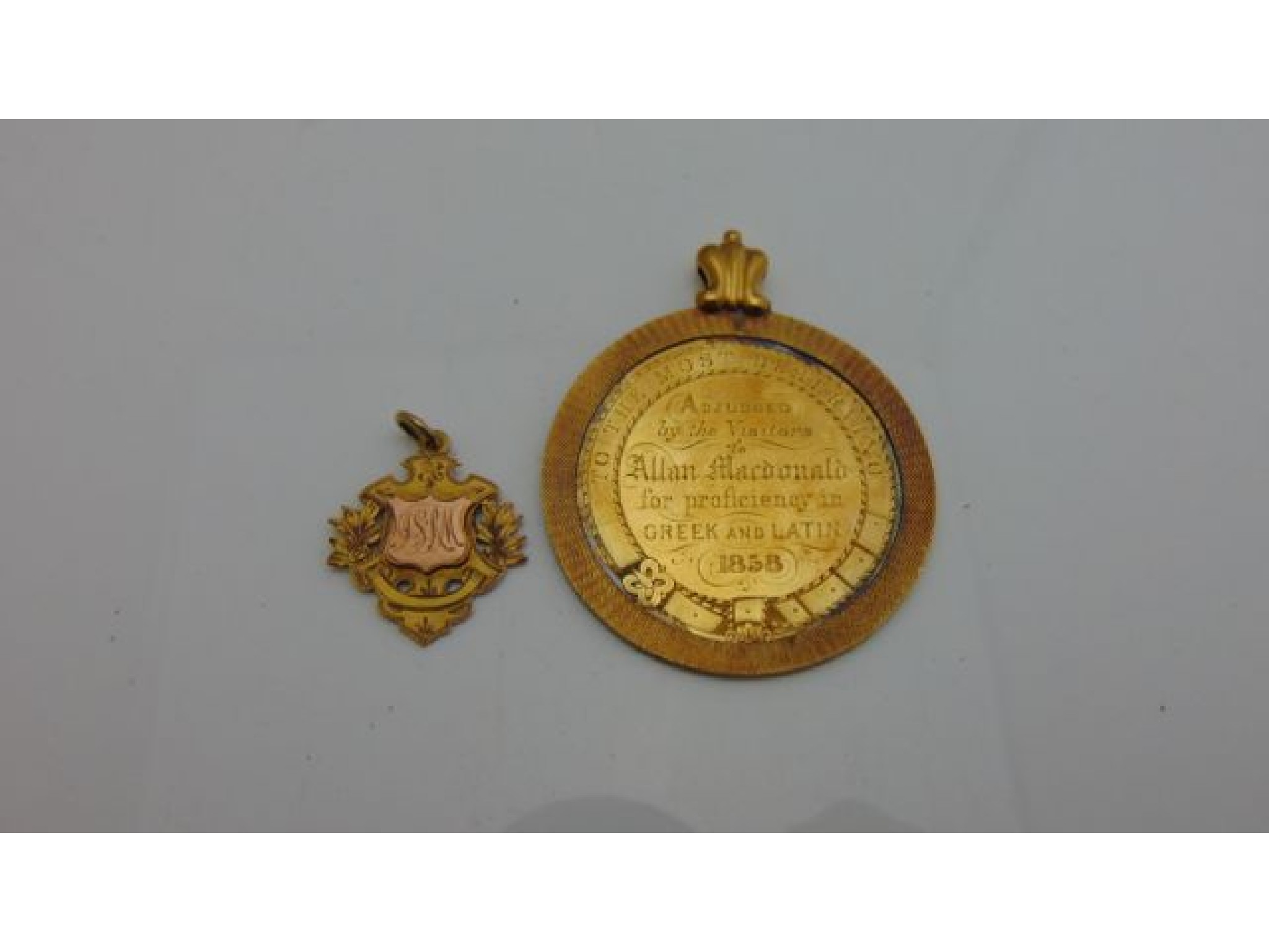 Appraisal: A gilt school medal to Allan Macdonald for proficiency in