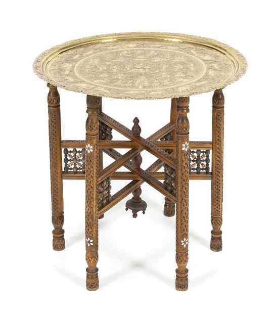 Appraisal: A Southeast Asian Brass Tray Table the circular brass tray