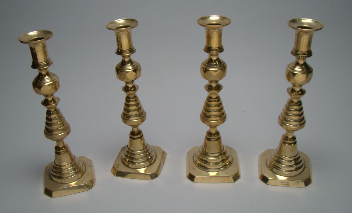 Appraisal: TWO UNUSUAL PAIRS OF BRASS PUSH-UP CANDLESTICKS Second Half of