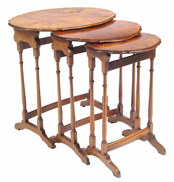 Appraisal: A set of three walnut nesting tables height in width