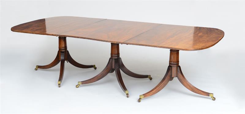 Appraisal: GEORGE III BRASS-MOUNTED MAHOGANY THREE-PEDESTAL DINING TABLE The rectangular top