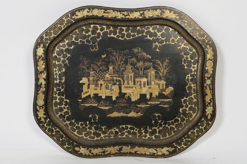 Appraisal: A PAPIER MACHE TEA TRAY of cartouche shape with a