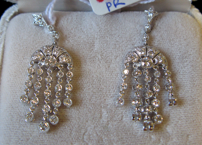 Appraisal: PAIR OF DIAMOND AND EIGHTEEN KARAT WHITE GOLD DANGLE EARRINGS