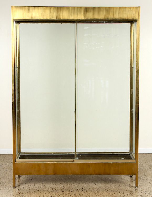 Appraisal: BRASS AND GLASS DISPLAY CASE SLIDING DOORS C A brass