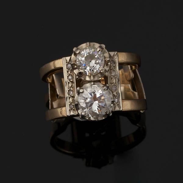 Appraisal: A diamond two stone ring centering a round brilliant-cut and