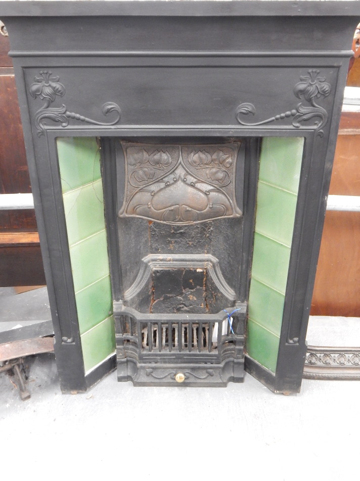 Appraisal: A late thC early thC cast iron fireplace in Art