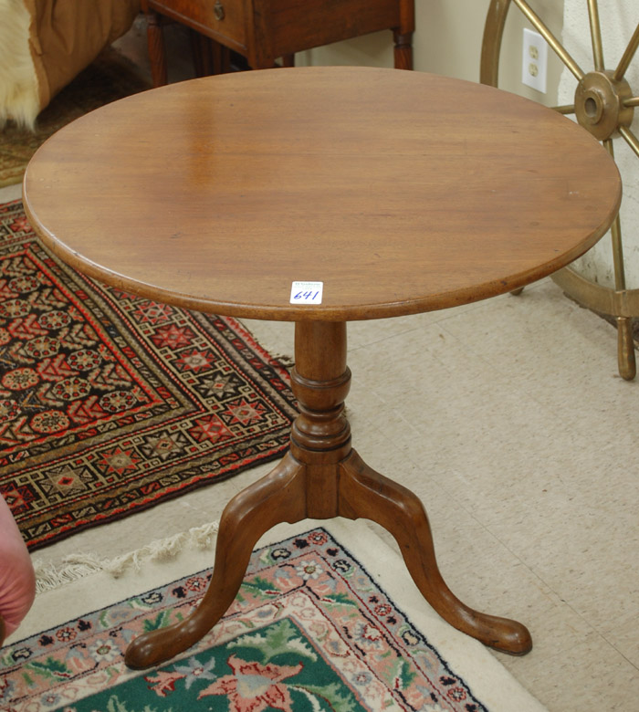 Appraisal: MAHOGANY TILT-TOP TEA TABLE th century the round top centered