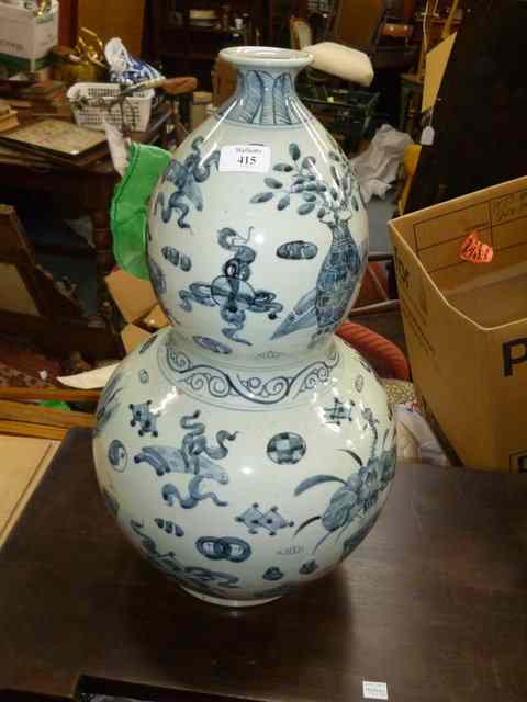 Appraisal: A LARGE DECORATIVE ORIENTAL BLUE AND WHITE VASE of double