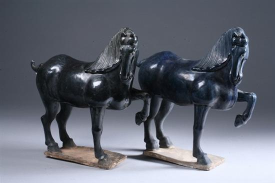 Appraisal: TWO CHINESE BLACK AND DARK BLUE POTTERY FIGURES OF HORSES