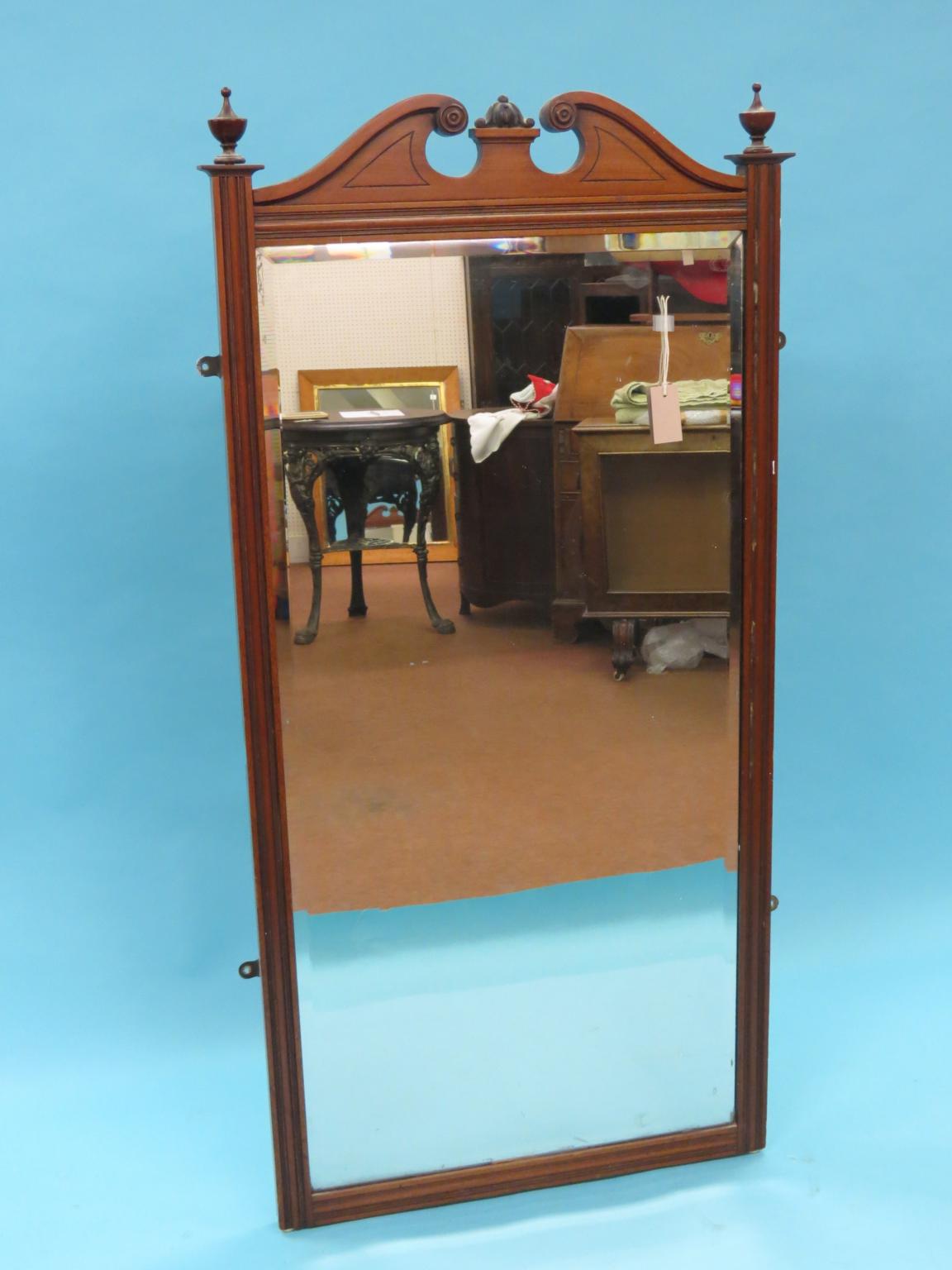 Appraisal: A large Victorian walnut robing mirror with swan-neck pediment ft