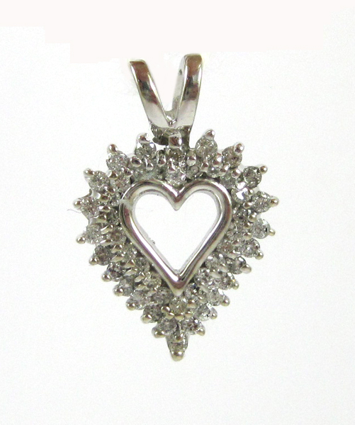 Appraisal: DIAMOND AND FOURTEEN KARAT WHITE GOLD PENDANT The open heart